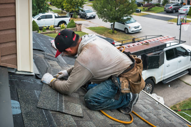 Professional Roofing technician working in Airmont, NY